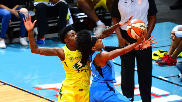natasha_howard_blocks_sykes_layup.jpg